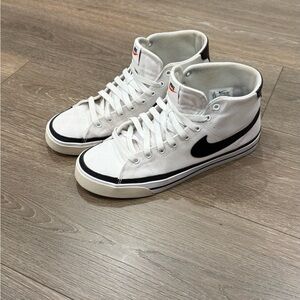 Nike White High-Top Sneakers with Black Swoosh